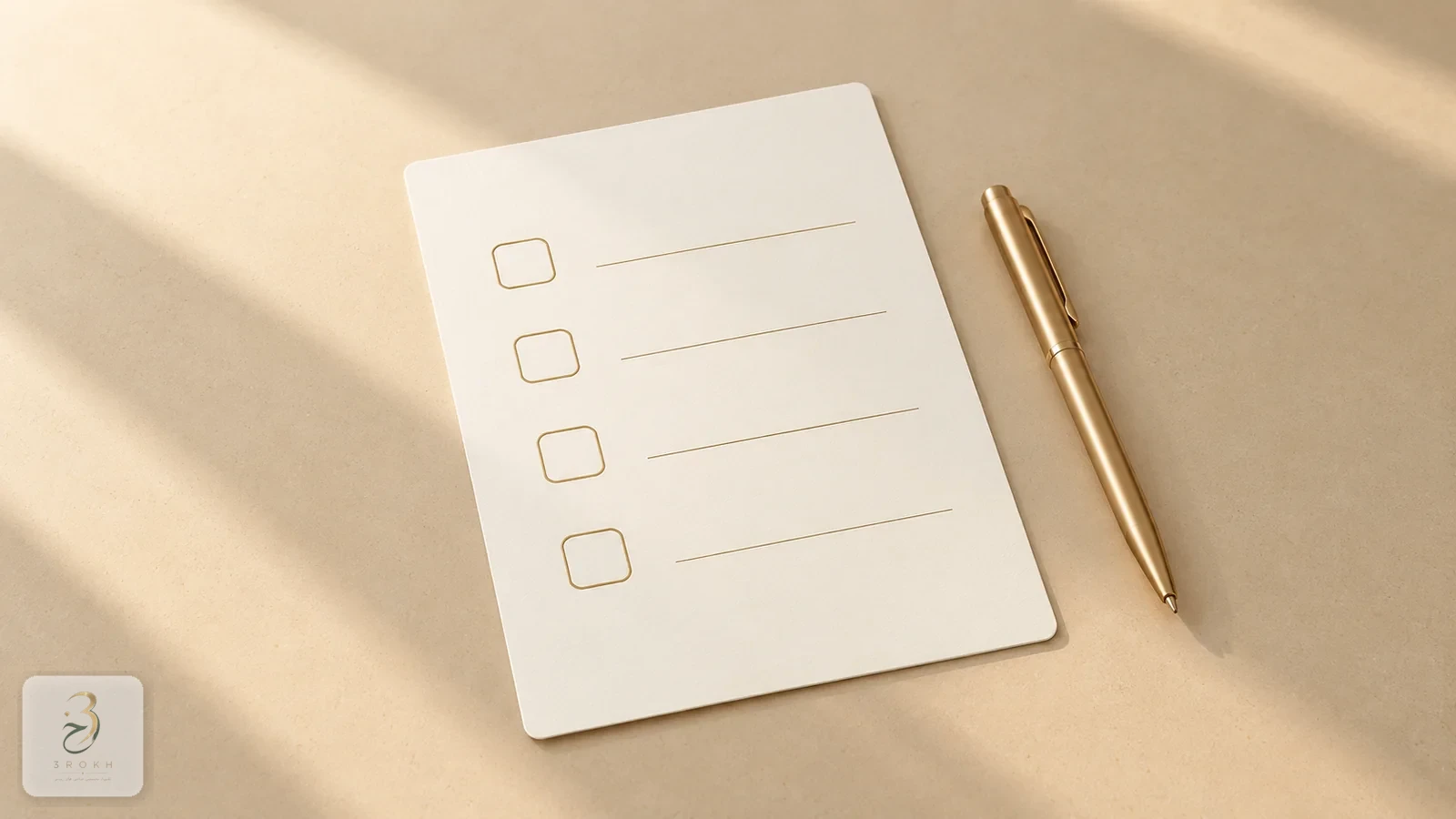A checklist card with four empty boxes and a gold pen